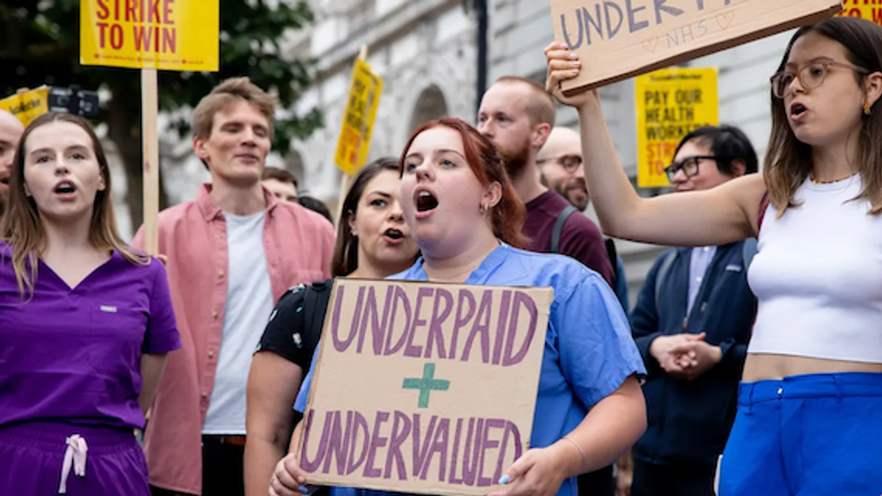 More than a dozen health unions accept British government's pay offer