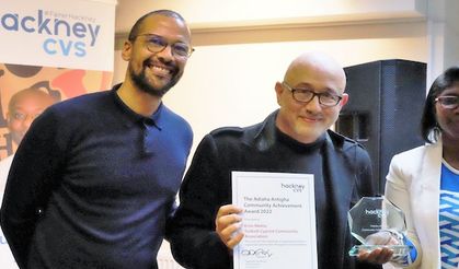 TCCA with its accolade of achievement being presented Erim Metto