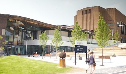 A man who raped an Exeter University student as she was asleep in bed has been jailed